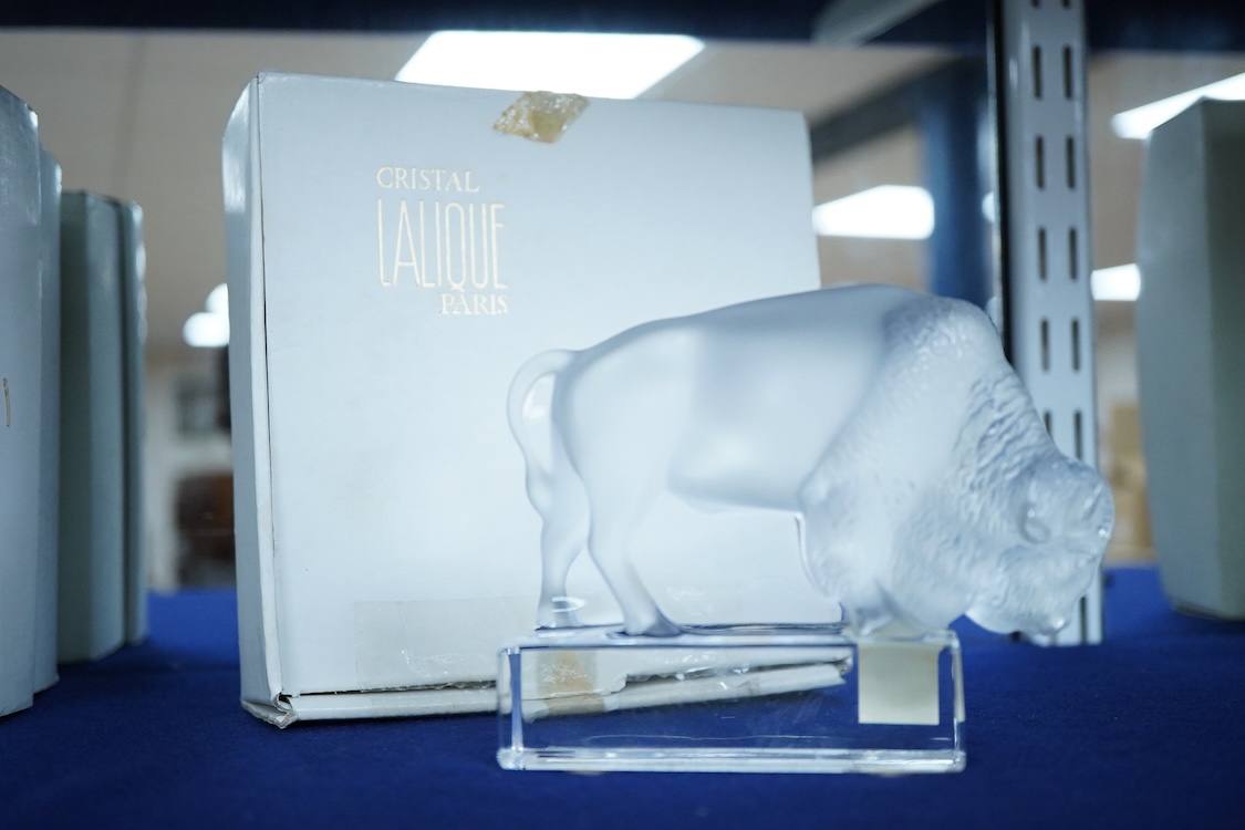 A Lalique crystal frosted glass Bison on polished clear glass paperweight paperweight (boxed), 12cm wide x 10cm high